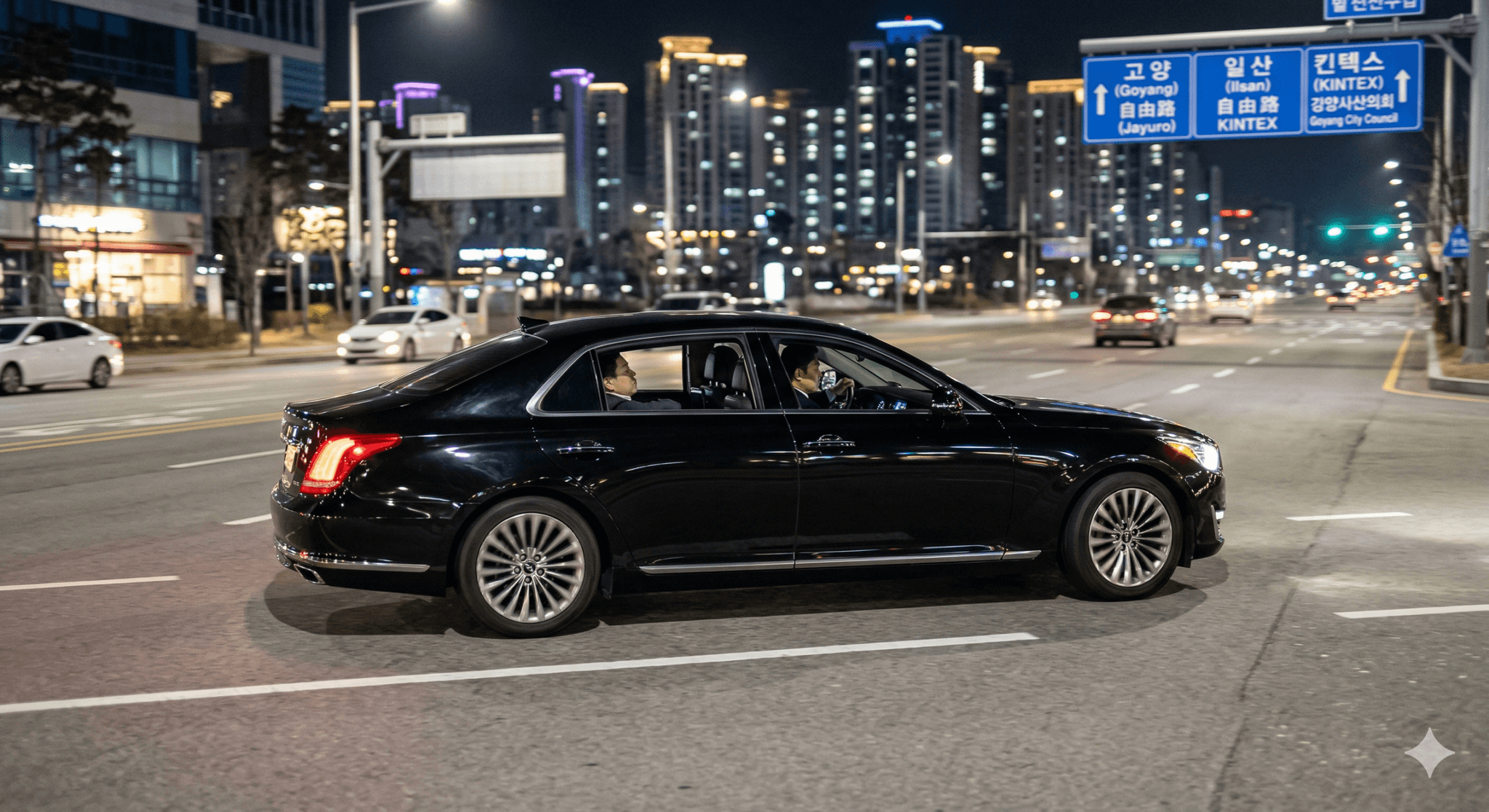 고양시(Goyang-si) 일산 도심 야경을 배경으로 luxury sedan이 안전하게 주행하는 모습과 professional chauffeur의 실루엣이 담긴 trustworthy corporate chauffeur service photorealistic 이미지.